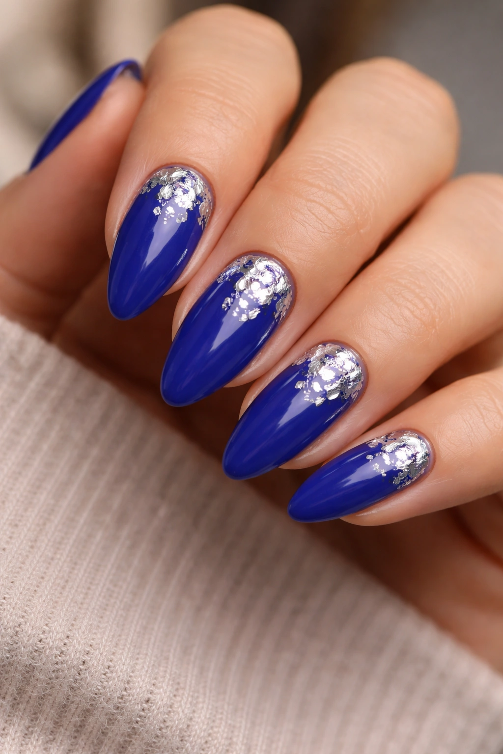 Almond nails with cobalt base and silver foil accents