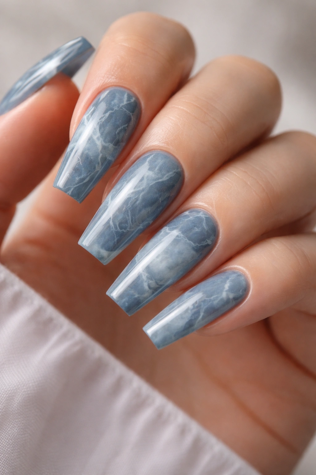 Blue-gray marble nails with fine white veining on coffin nails
