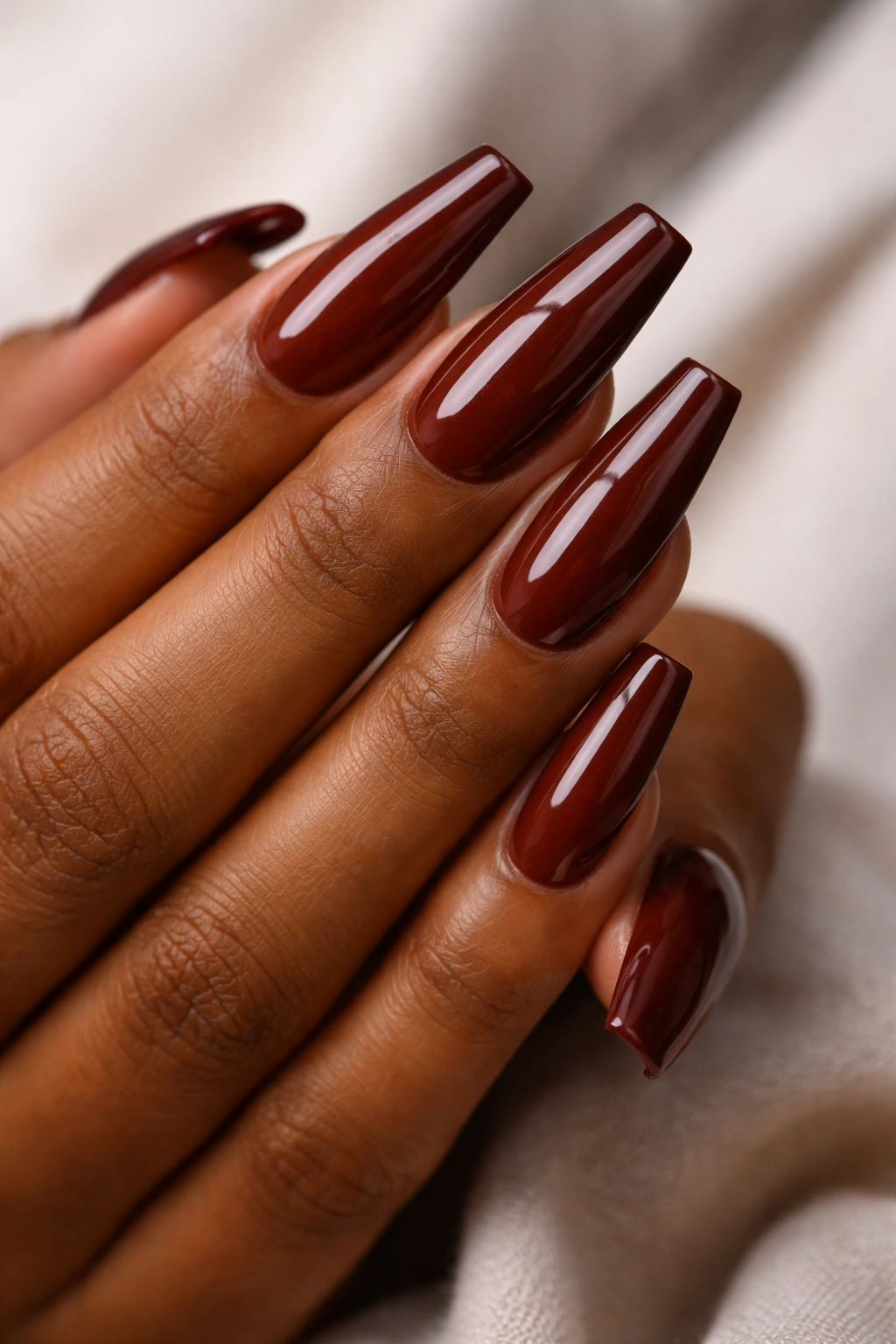 Close-up brick red coffin nails with warm brown depth
