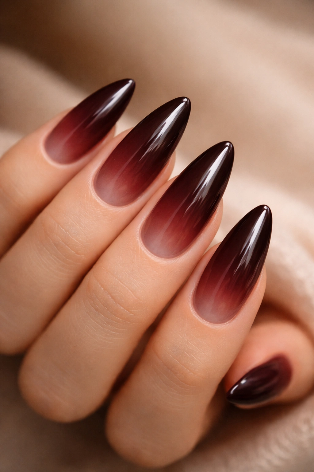 Burgundy to espresso ombre on almond nails
