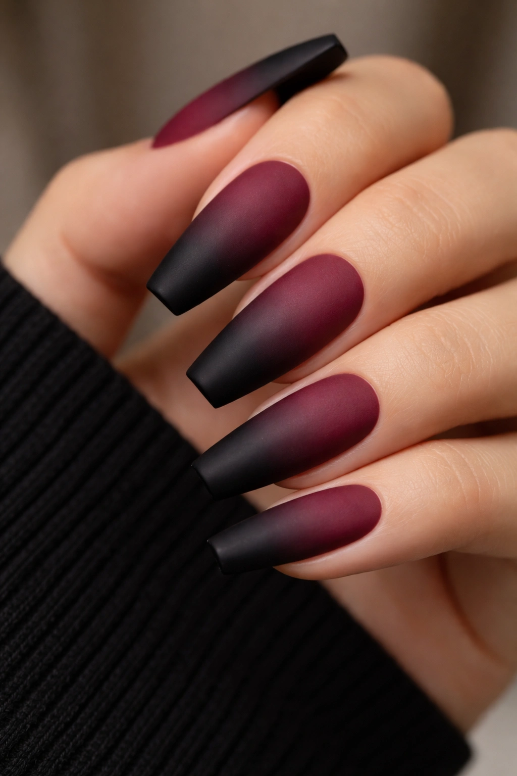 Matte burgundy ombré nails fading into black tips