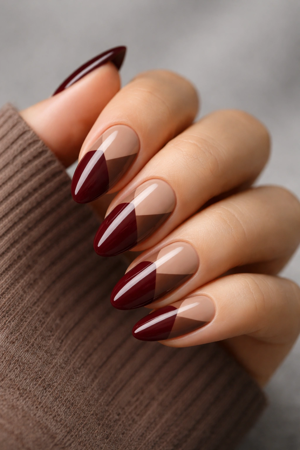 Almond nails with burgundy block color and brown contrast