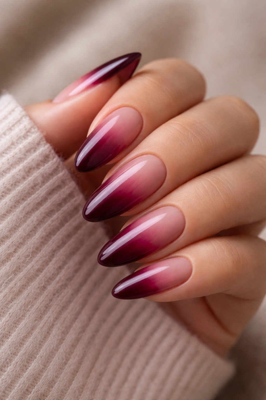 Almond nails with burgundy ombre gradient from nude to wine