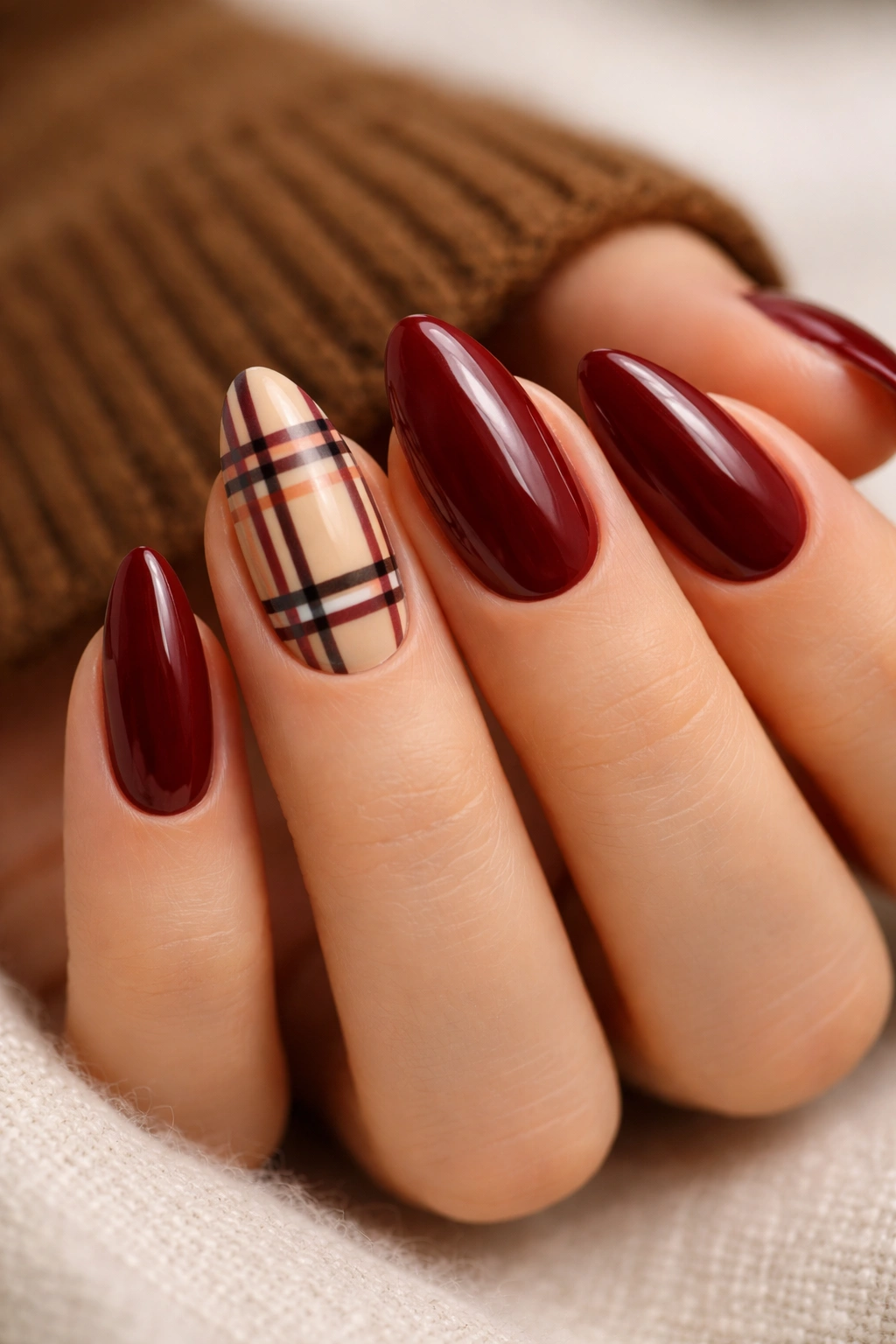 Almond nails with burgundy plaid accent nails