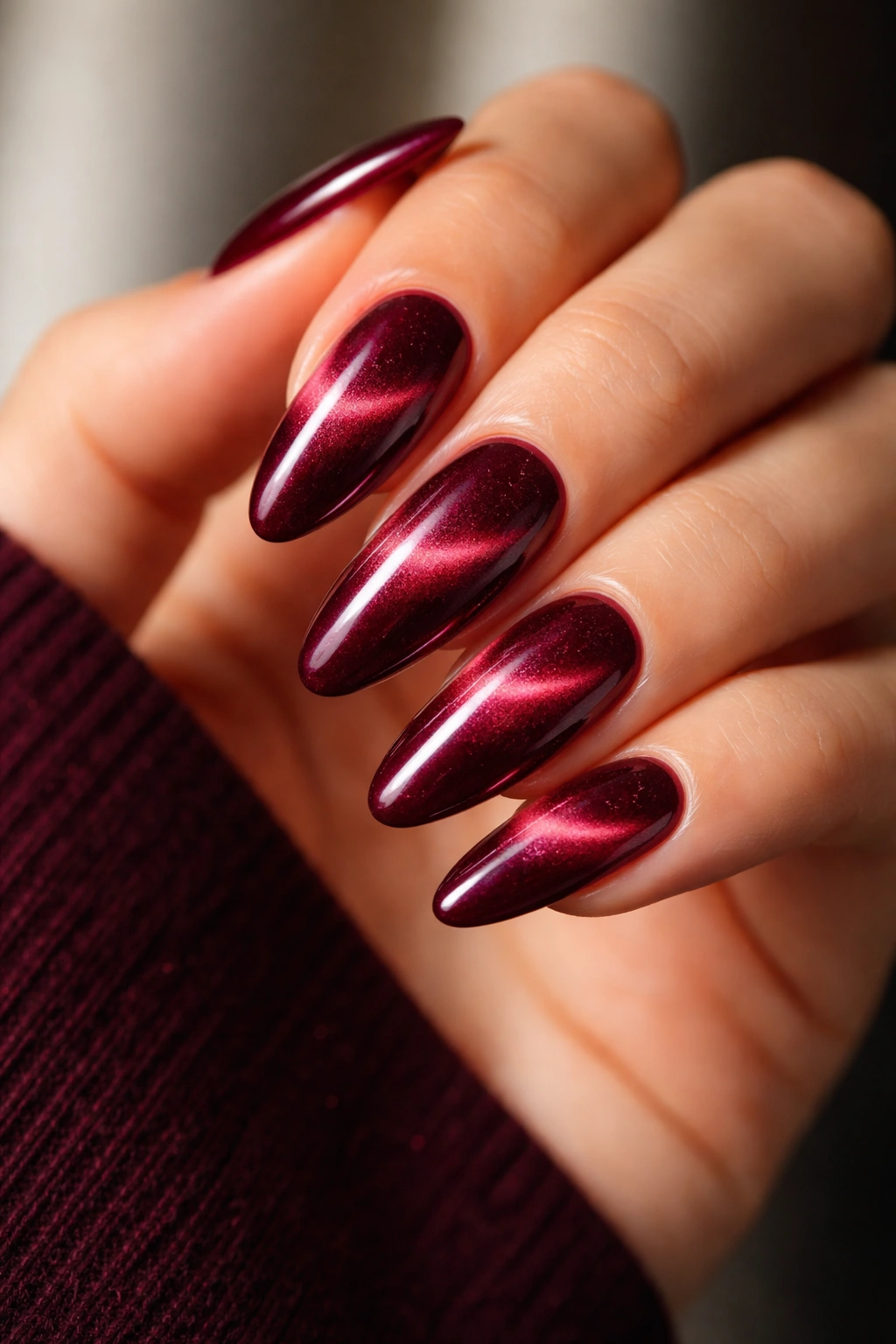 Long almond nails with velvet burgundy cat-eye and magnetic stripe