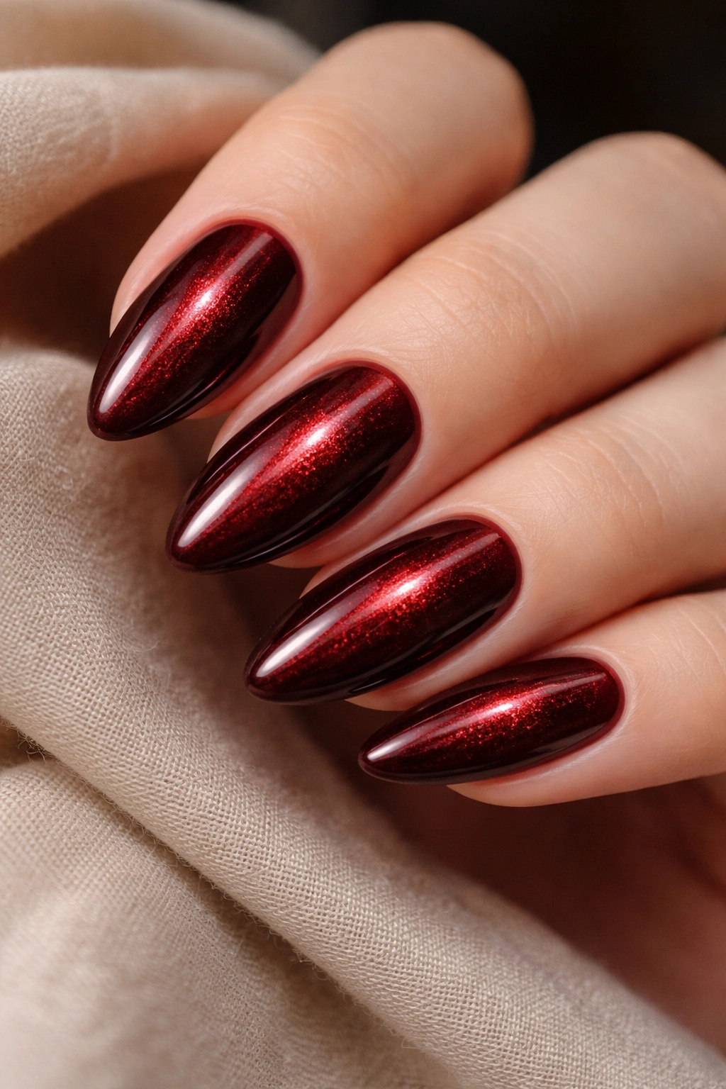 Almond nails with velvet cat-eye red magnetic line