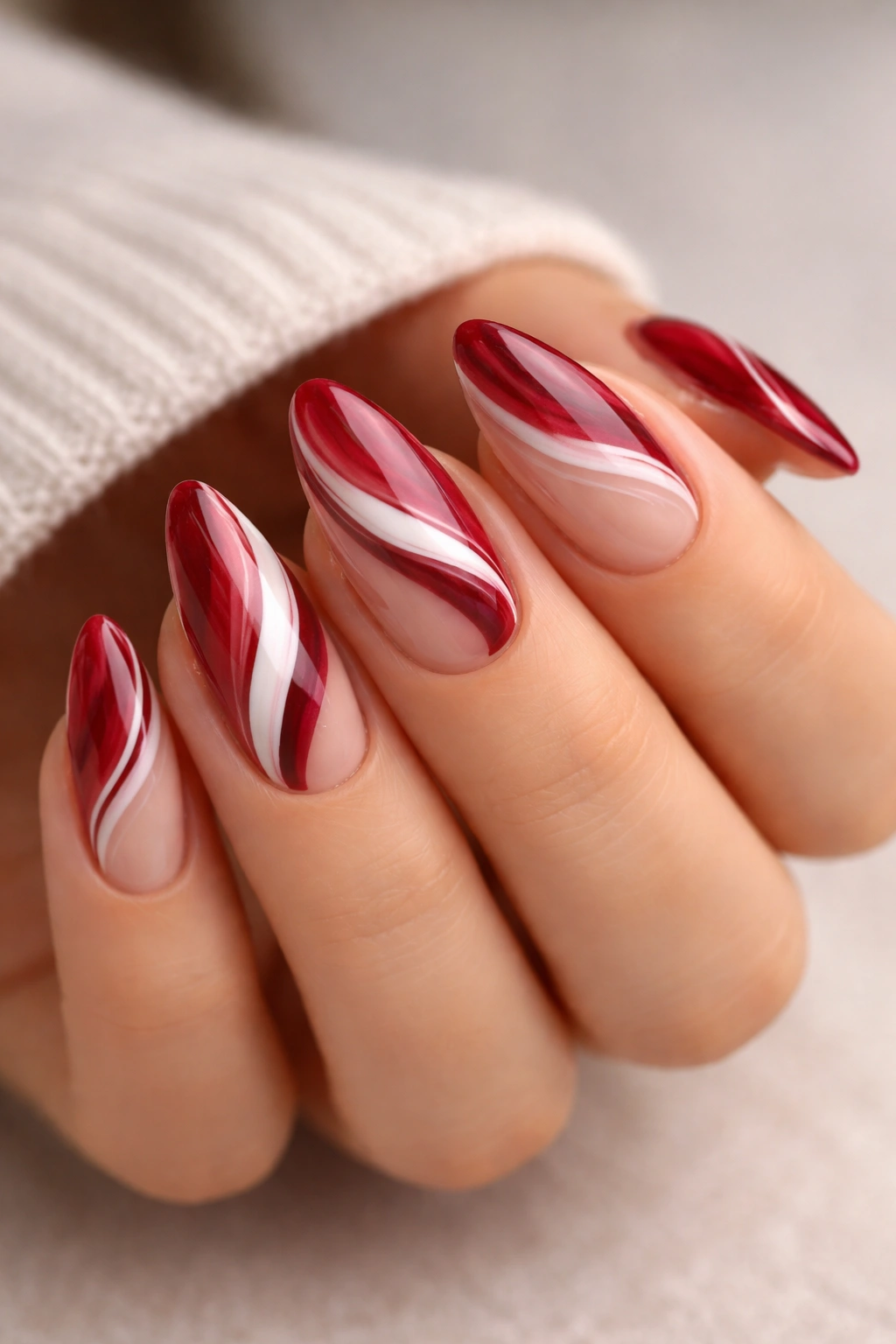 Almond nails with cherry red marble swirls using white and wine tones