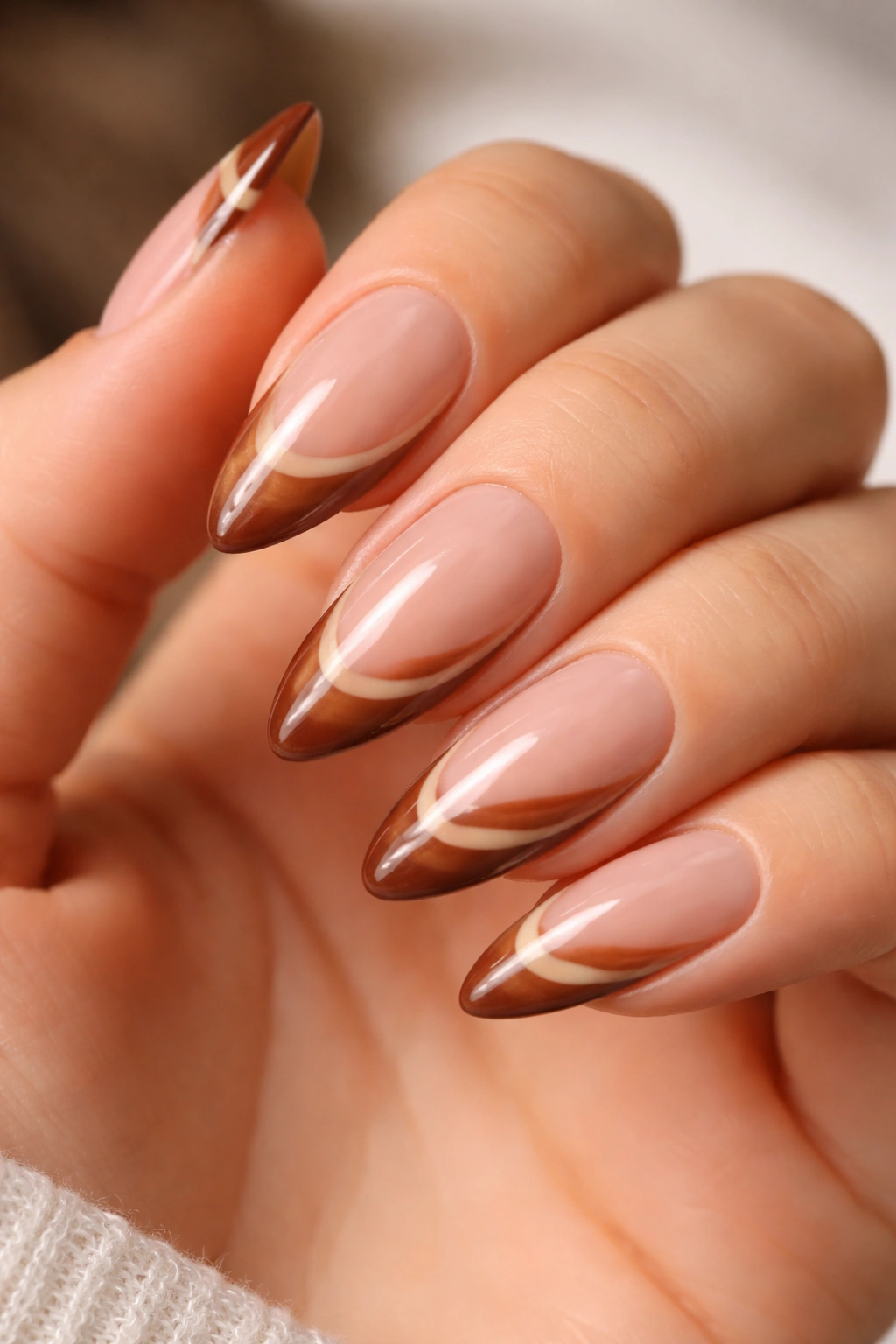 Almond nails with chestnut caramel swirl French tips
