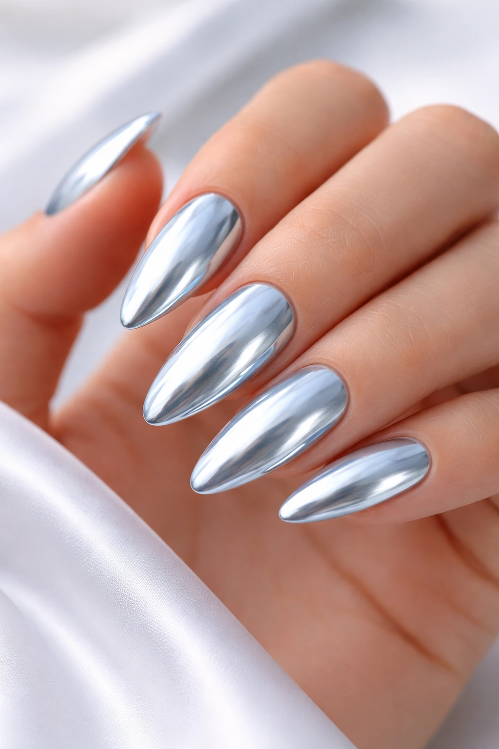 Chrome blue almond nails with mirror finish