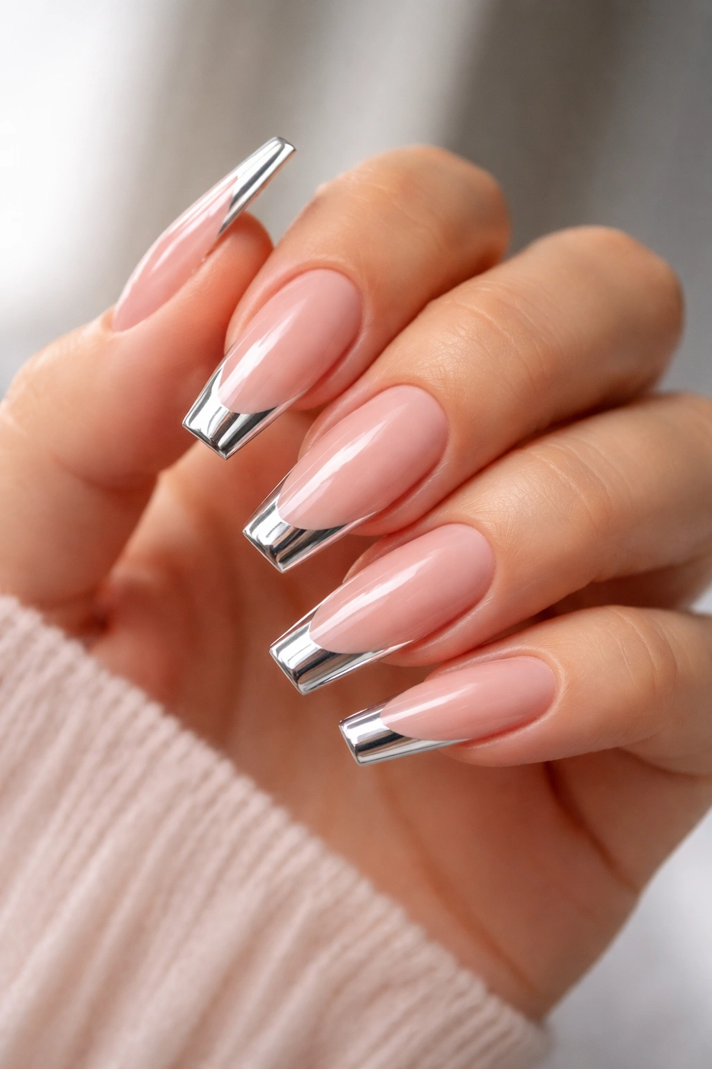 Chrome outlined French tips on sheer pink coffin nails