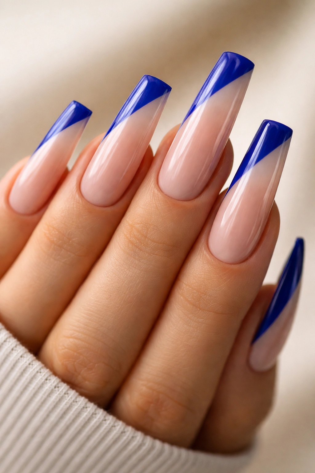 Long coffin nails with cobalt blue diagonal side-swoop tip