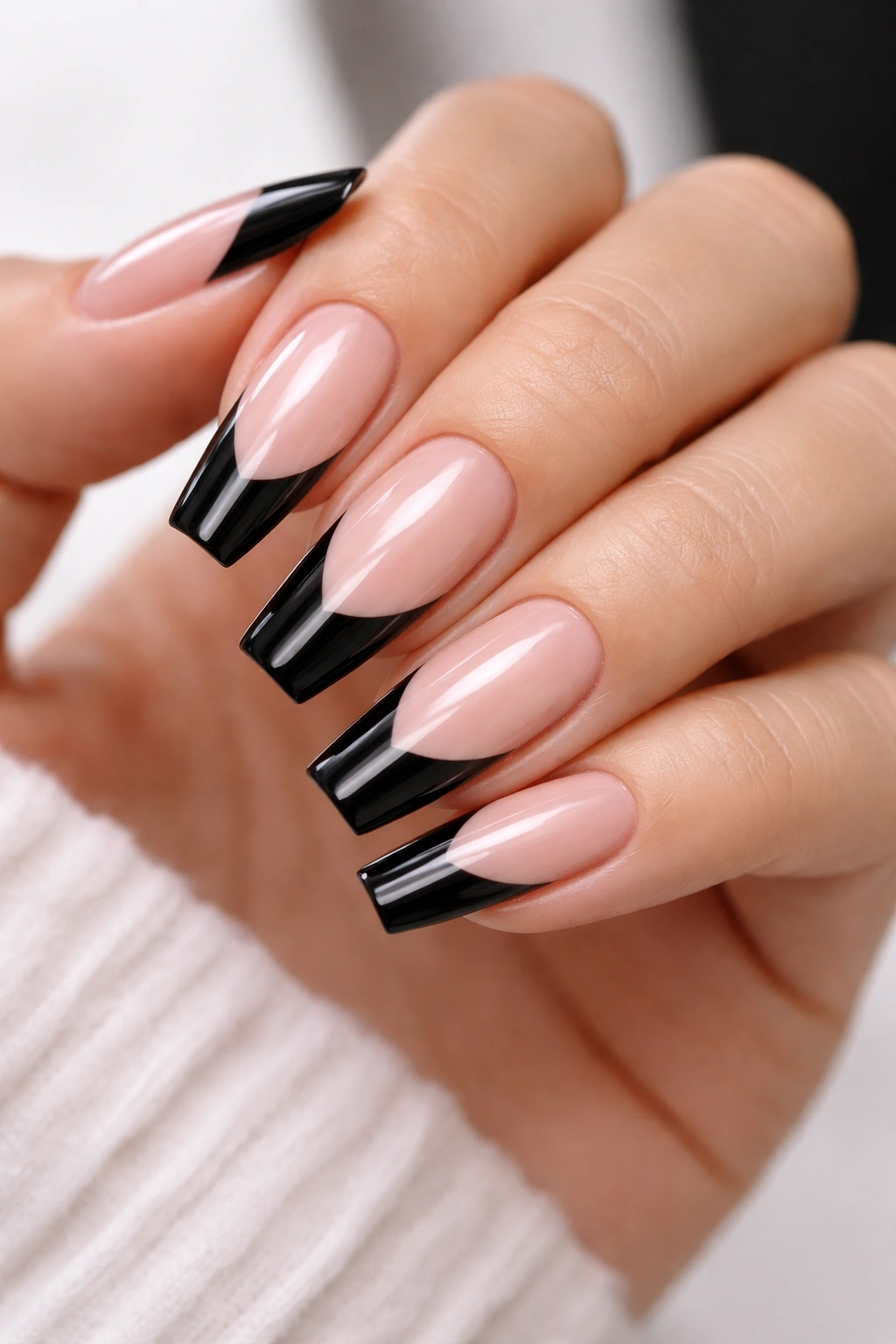 Coffin nails with sheer blush base and glossy black French tips
