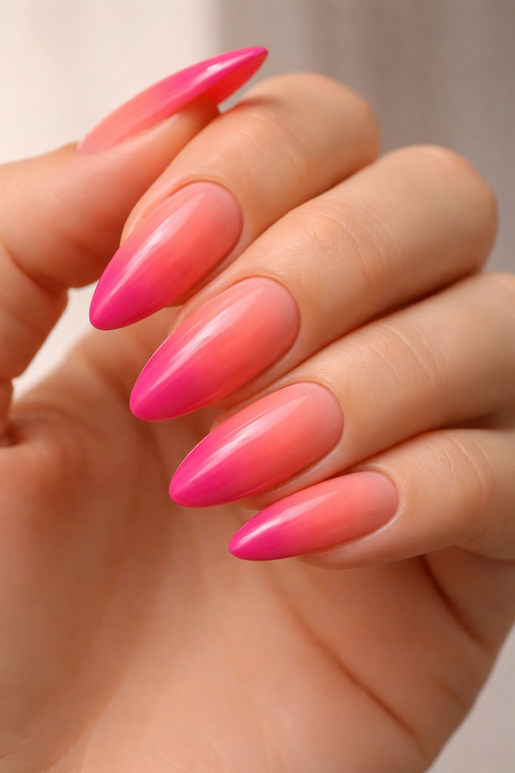 Coral to fuchsia gradient on almond nails