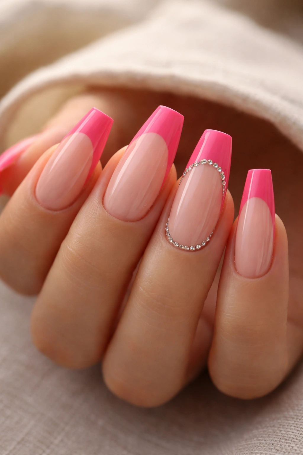 Coffin nails with pink tips and tiny crystals at the smile line