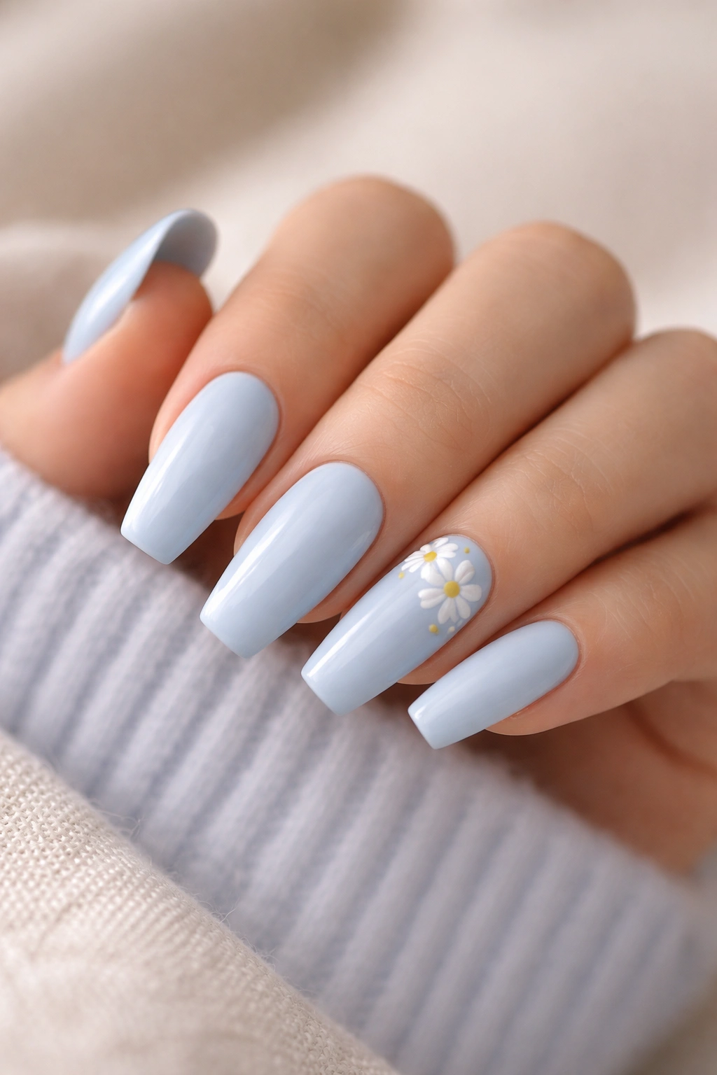 Baby blue nails with white daisy accents on accent nails