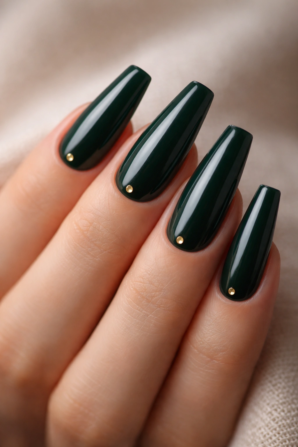 Close-up of coffin nails in dark green with tiny gold studs