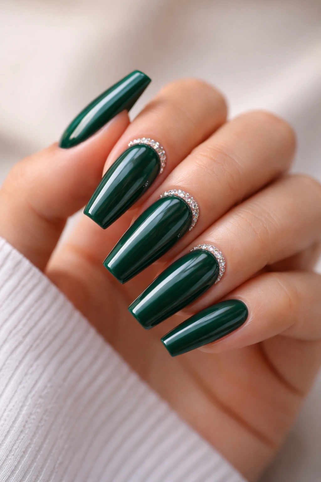 Close-up of Dark Jade Emerald Nails With Tiny Crystal Cuticles featuring crystal crescents