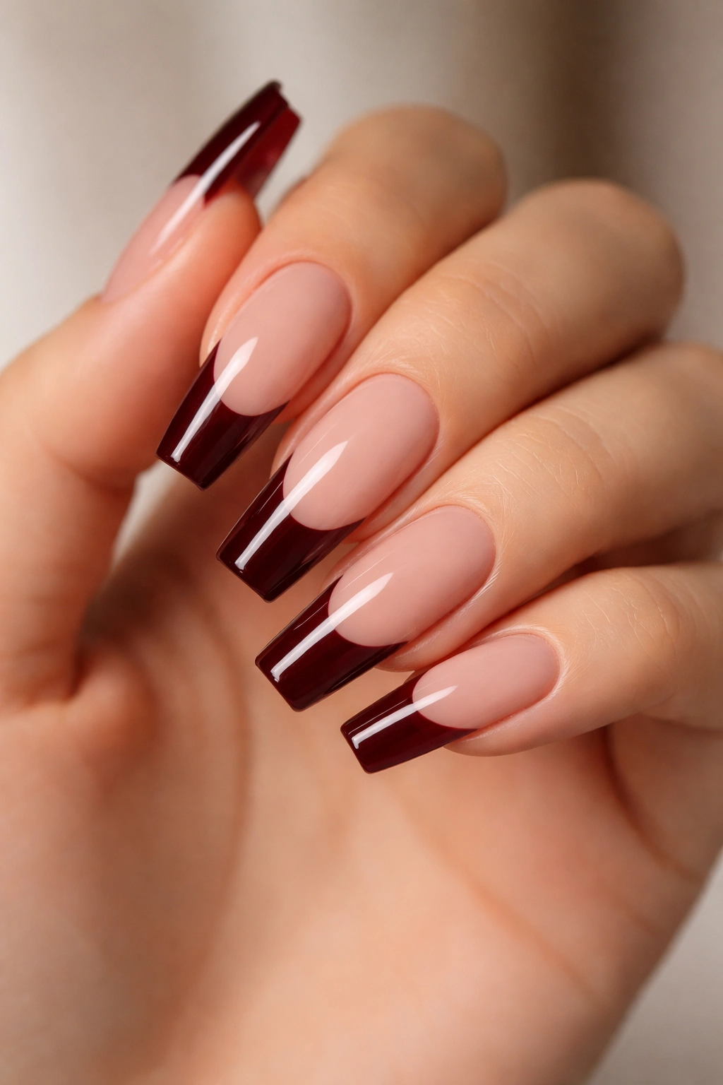 Coffin nails with dark red French tip on nude base