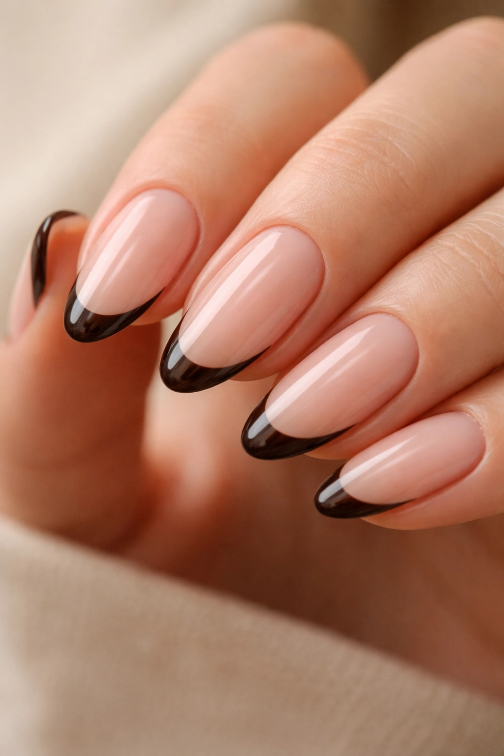 Almond nails with pink-beige base and dark espresso micro-French tip