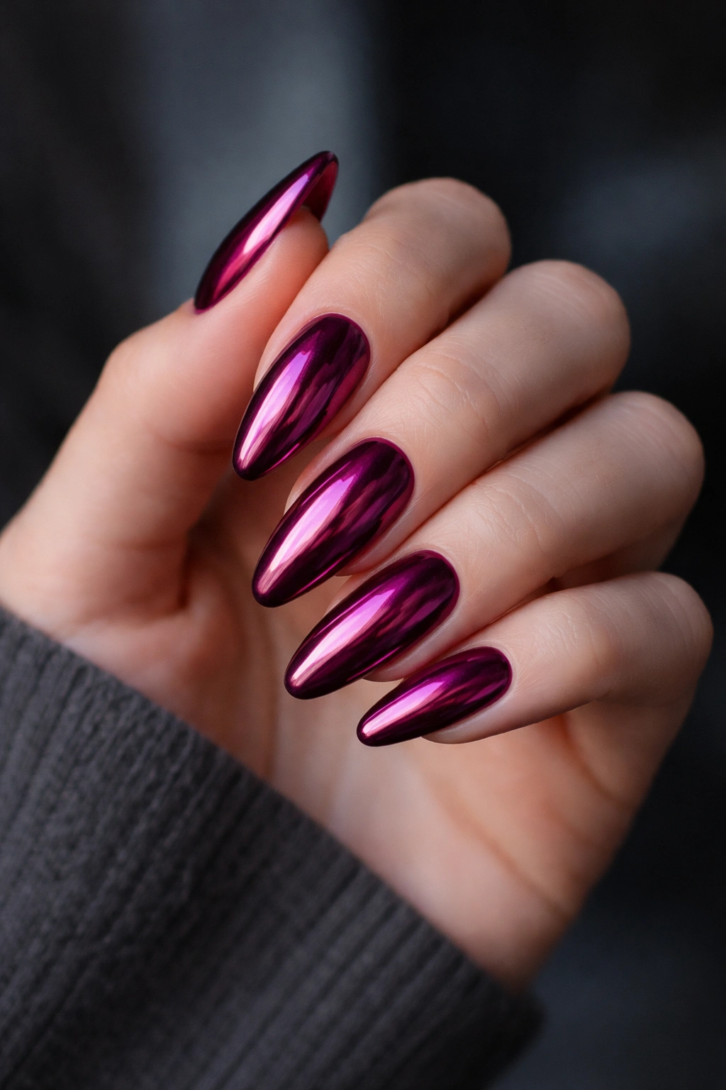 Deep berry chrome almond nails with rich reflective finish