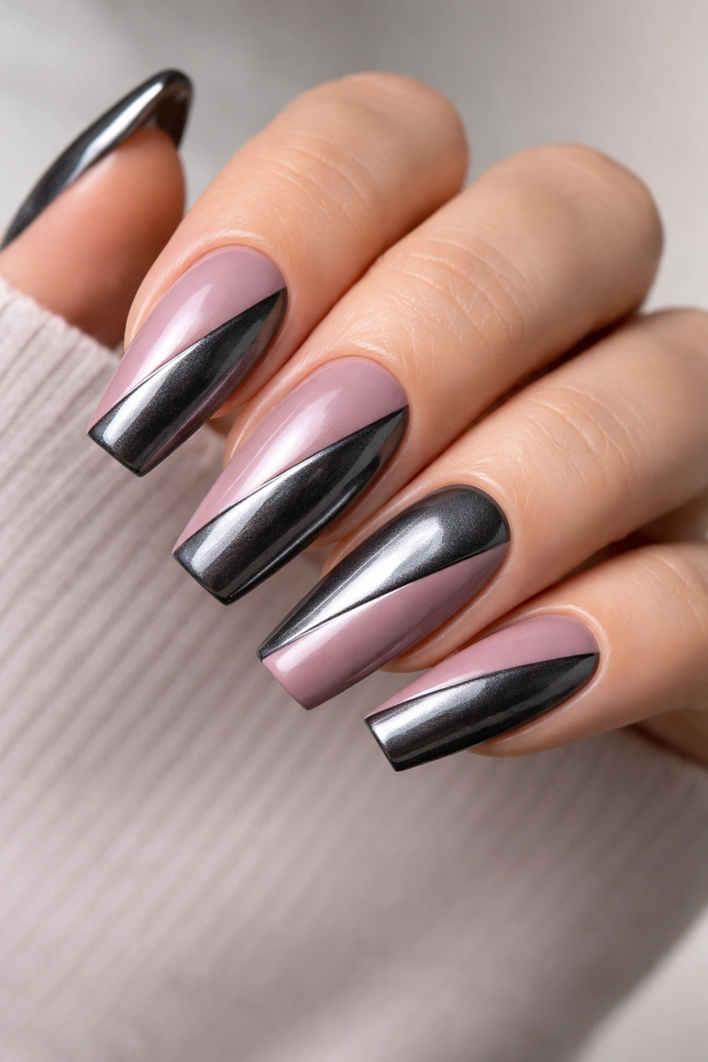 Close-up of mauve and gunmetal diagonal split coffin nails.