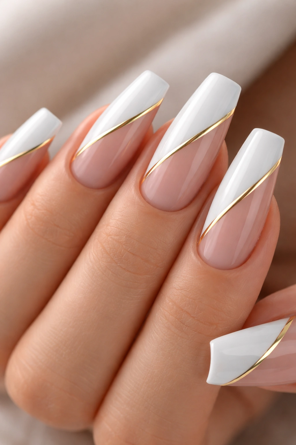 Close-up of coffin nails with diagonal white blocks and a gold stripe along the seam