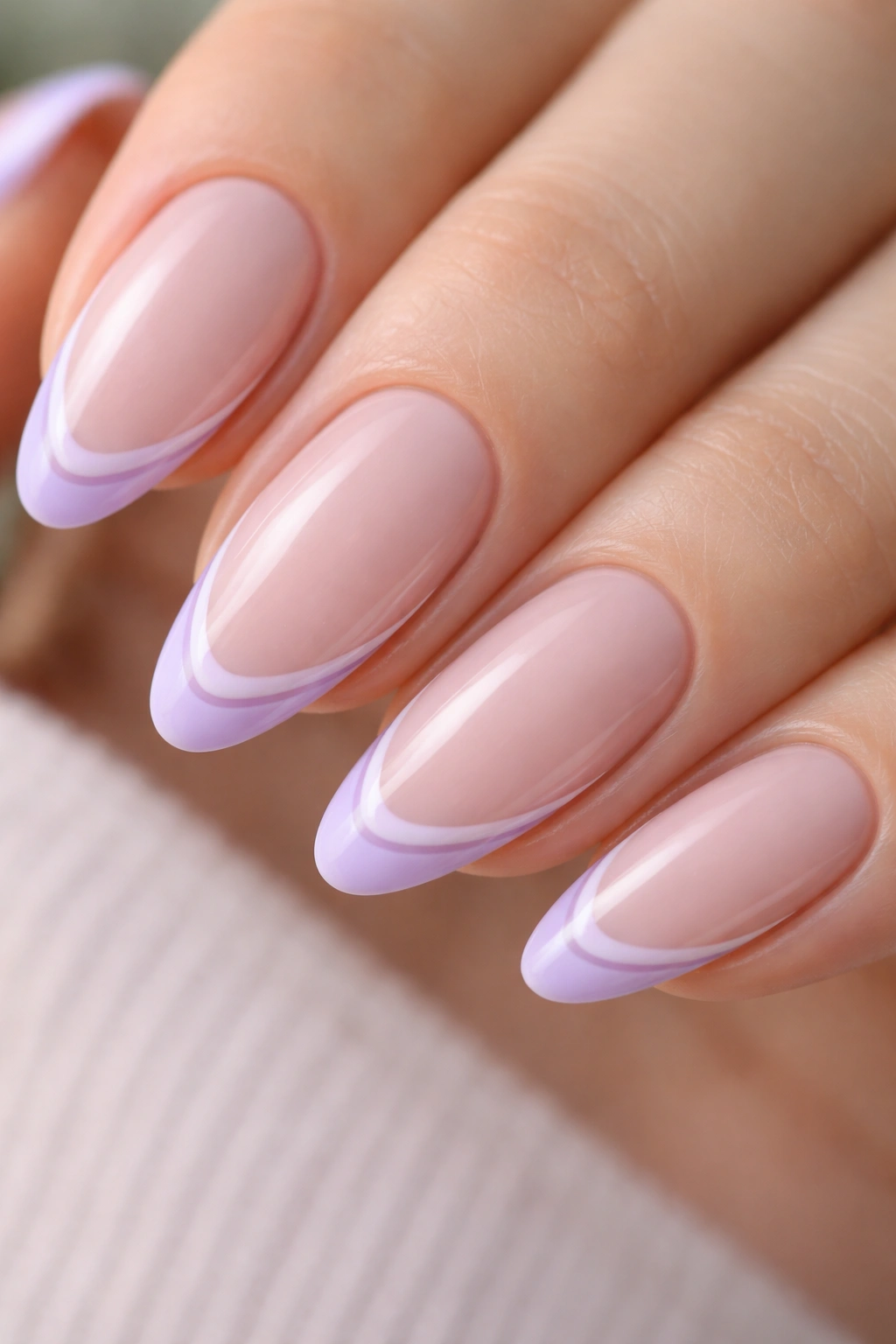 Almond nails with double lavender French tips on nude base