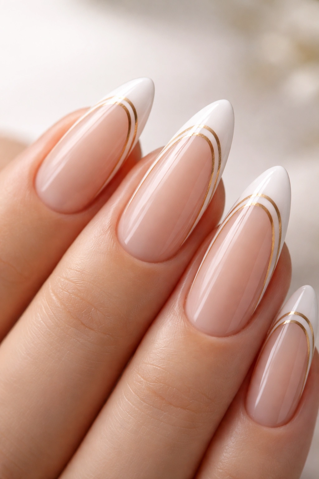 Almond nails with two slim lines and a clear center on a nude base.