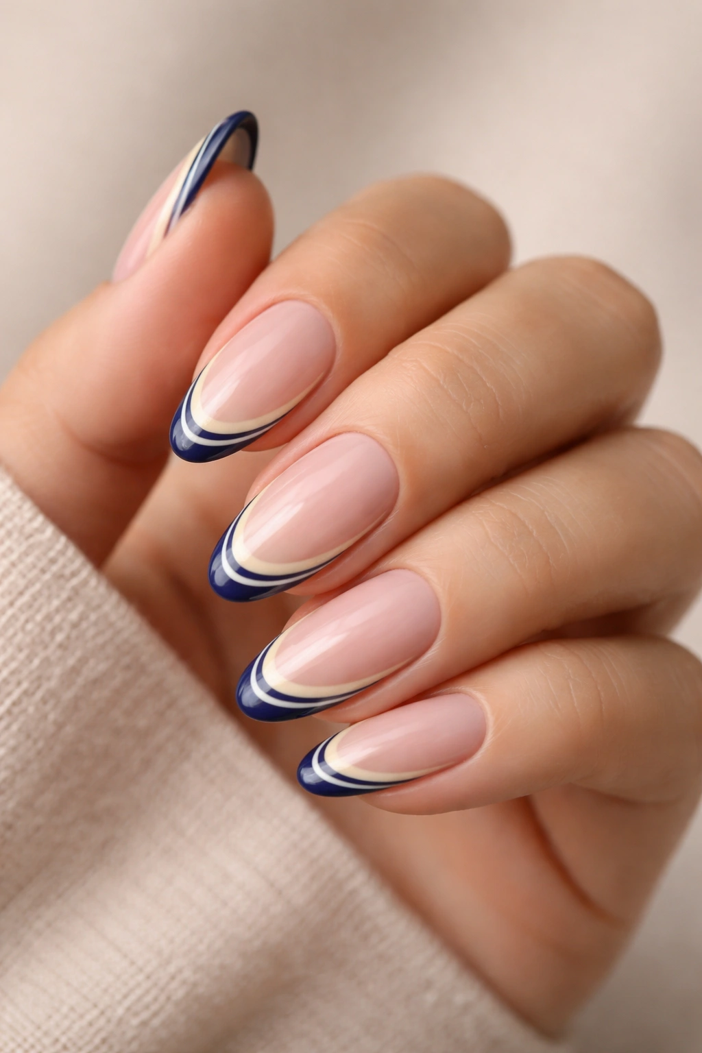 Almond nails with two thin colored French tips