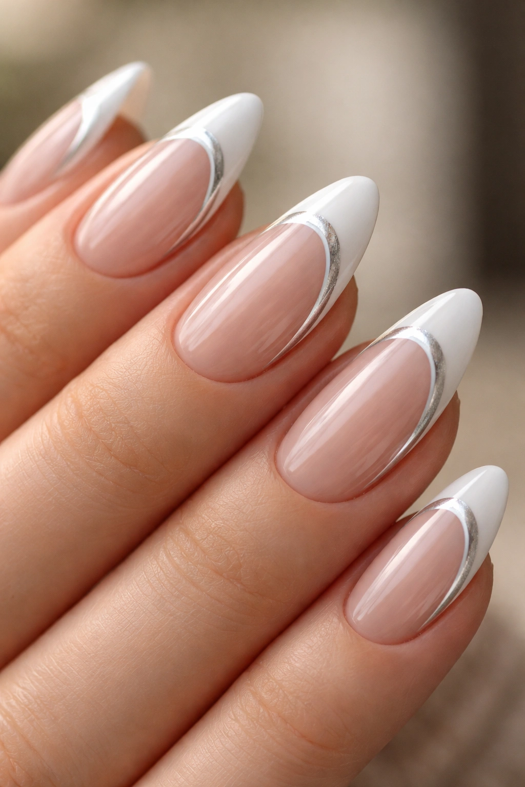 Almond nails with double-line French tips: two slim lines along the edge