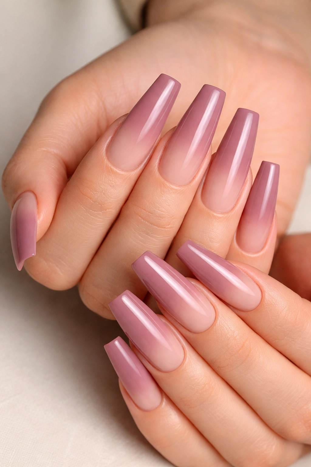 Coffin nails with nude to dusty mauve ombre