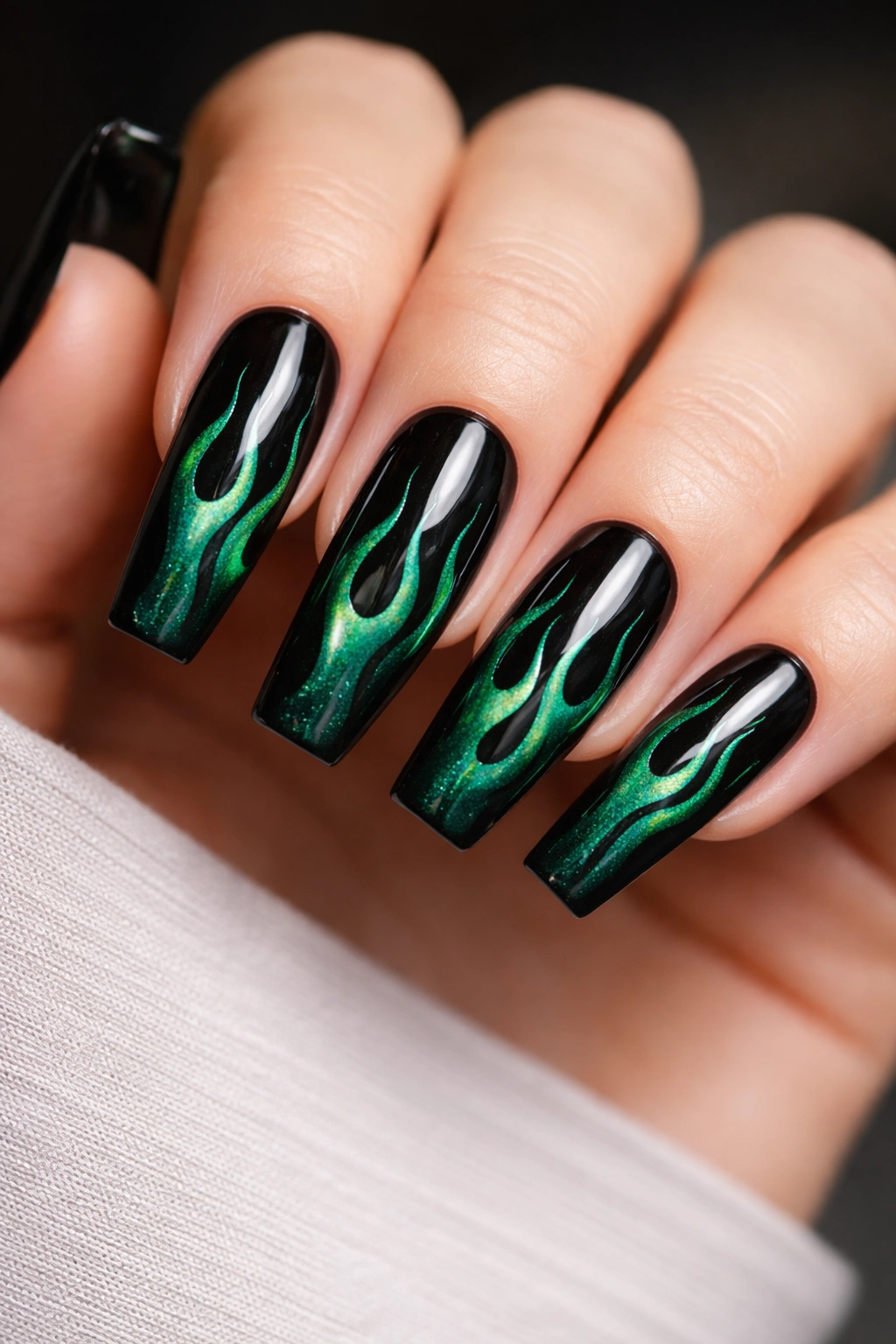 Close-up of Emerald Flame Coffin Nails With Black Detailing