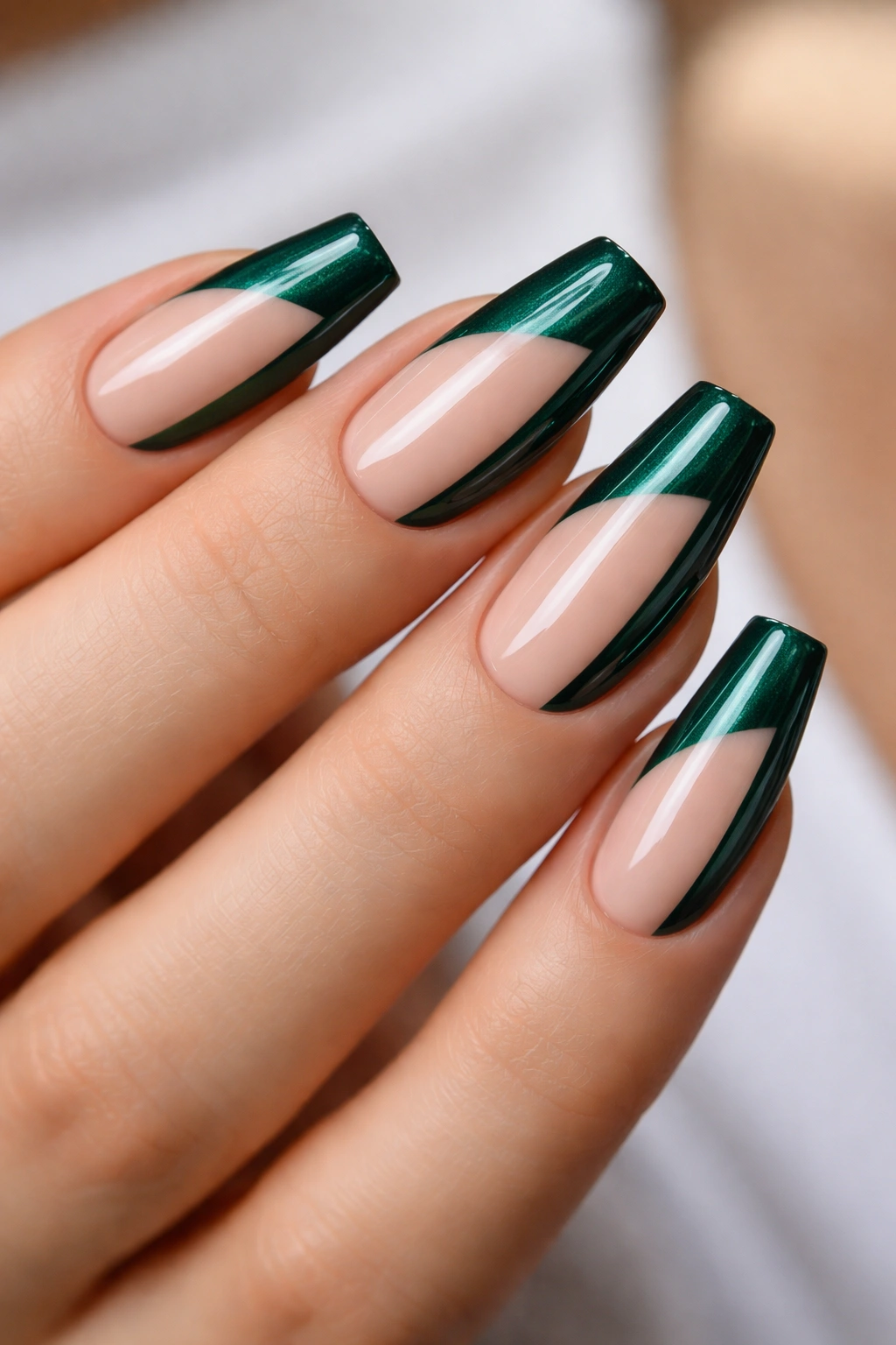 Negative-space emerald coffin nails with a diagonal side-swipe reveal natural base