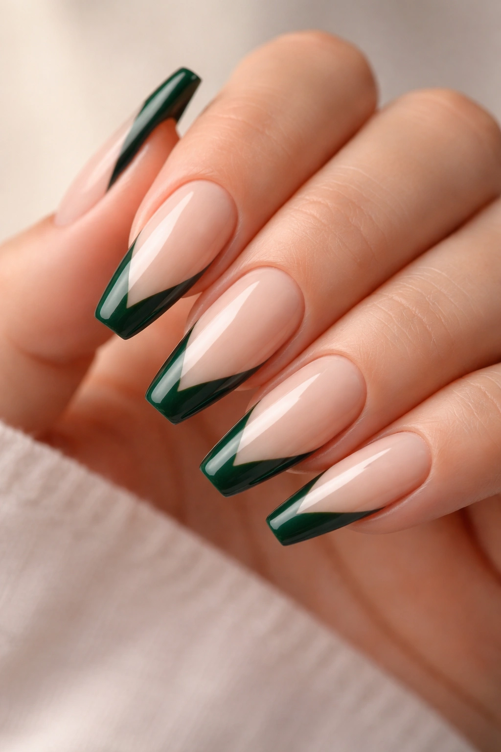 Emerald V-French tips on a milky nude base