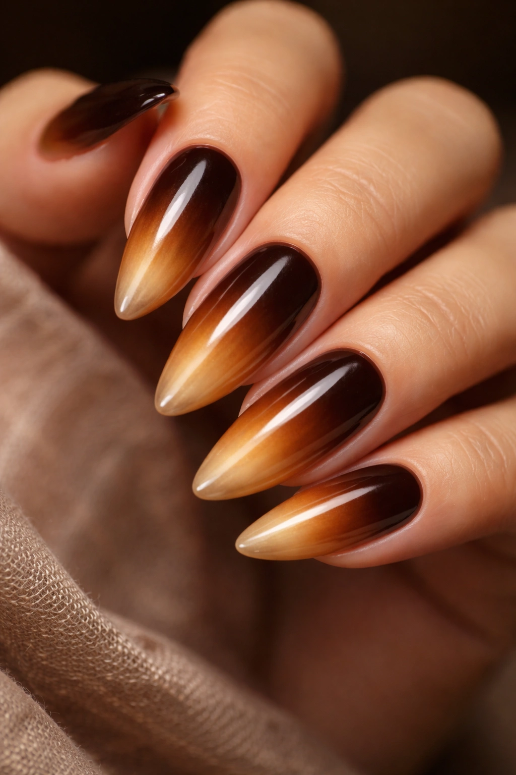 Long almond nails with espresso to caramel gradient