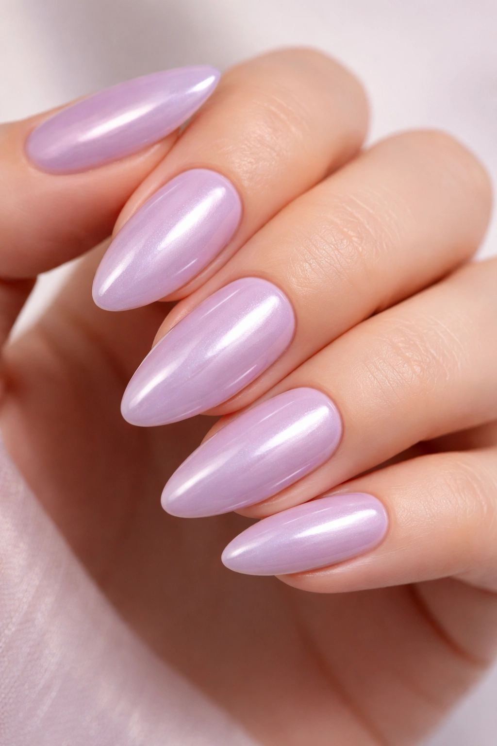 Almond nails with glazed lilac finish and pearly sheen