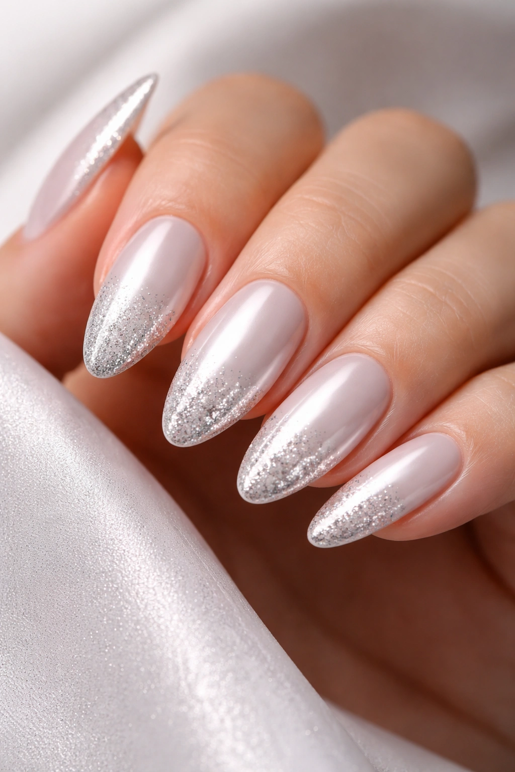 White chrome nails with glitter fade tips