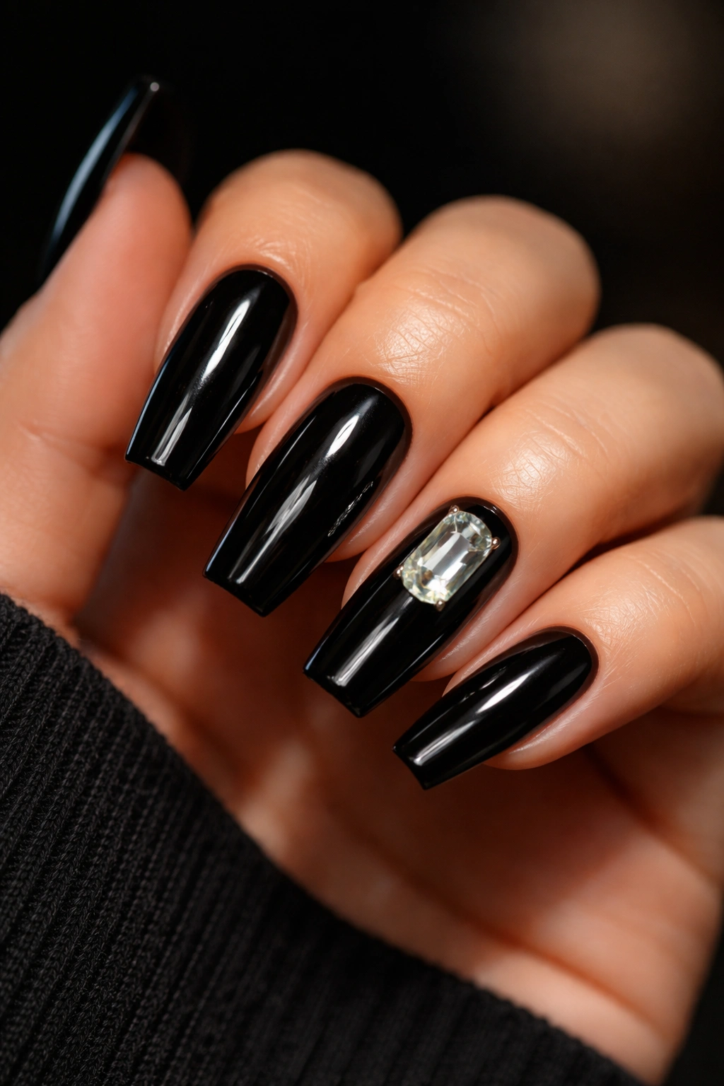 Glossy black coffin nails with a single emerald-cut accent stone
