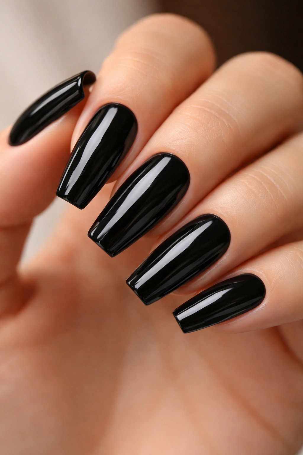 Glossy jet-black coffin nails with crisp squared edges and central reflection