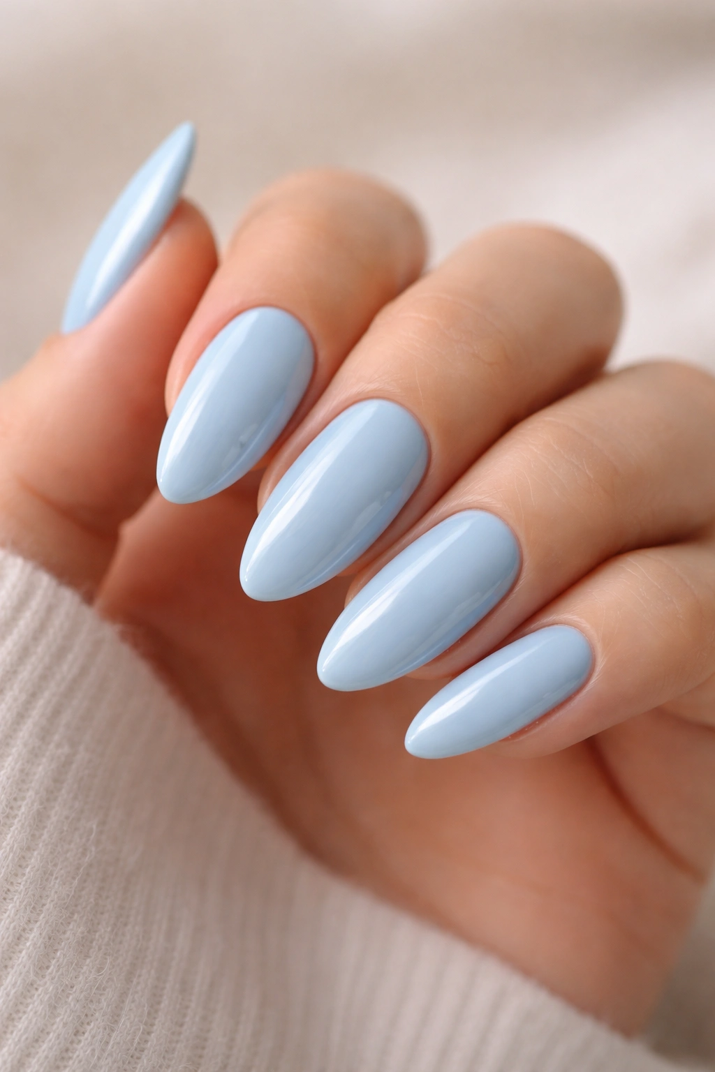 Glossy baby blue almond nails with high-gloss finish