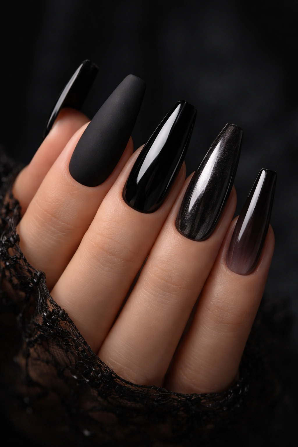 Nails displaying matte, gloss, smoked chrome, and jelly finishes on coffin nails