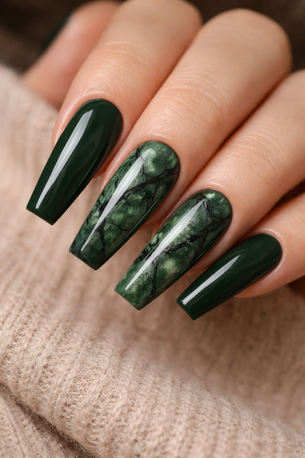 Dark green marble nails with fine black veining on coffin shapes