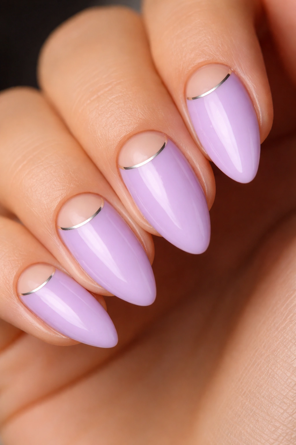 Almond nails with nude half-moon and lilac fill, silver outline