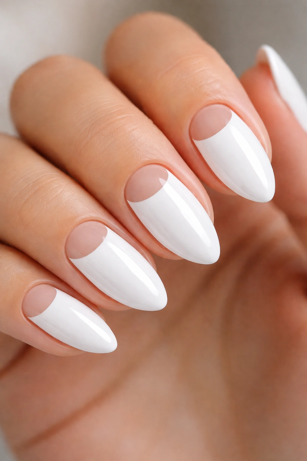 Almond nails with half-moon negative space near cuticle