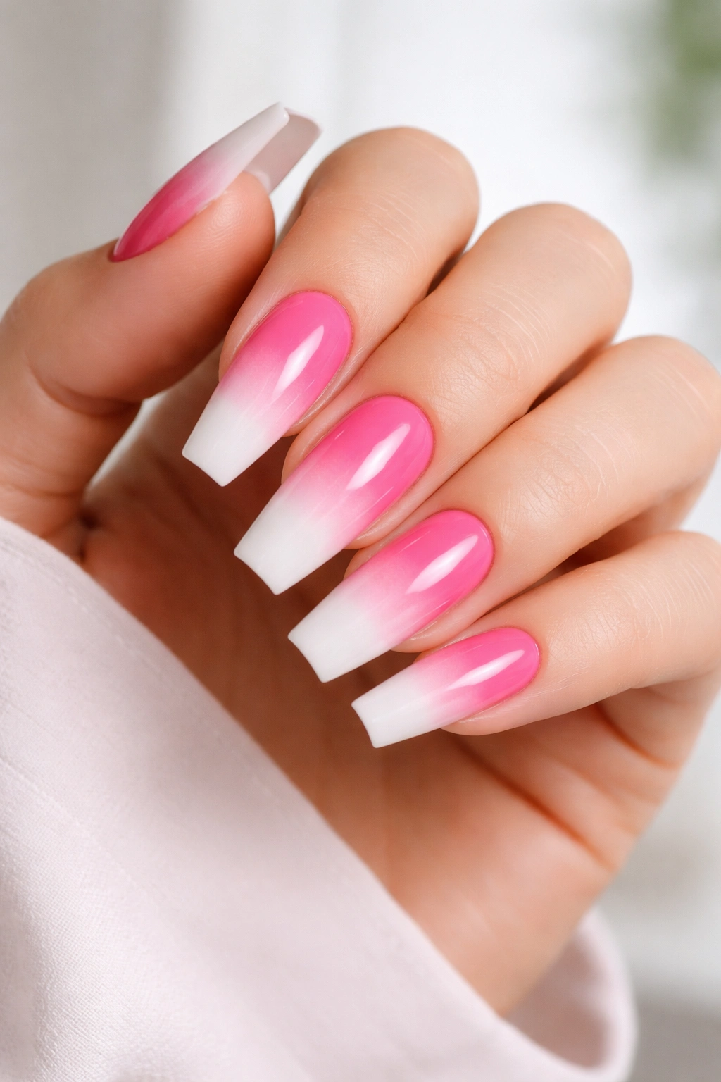 Long coffin nails with pink base and white cloud tips