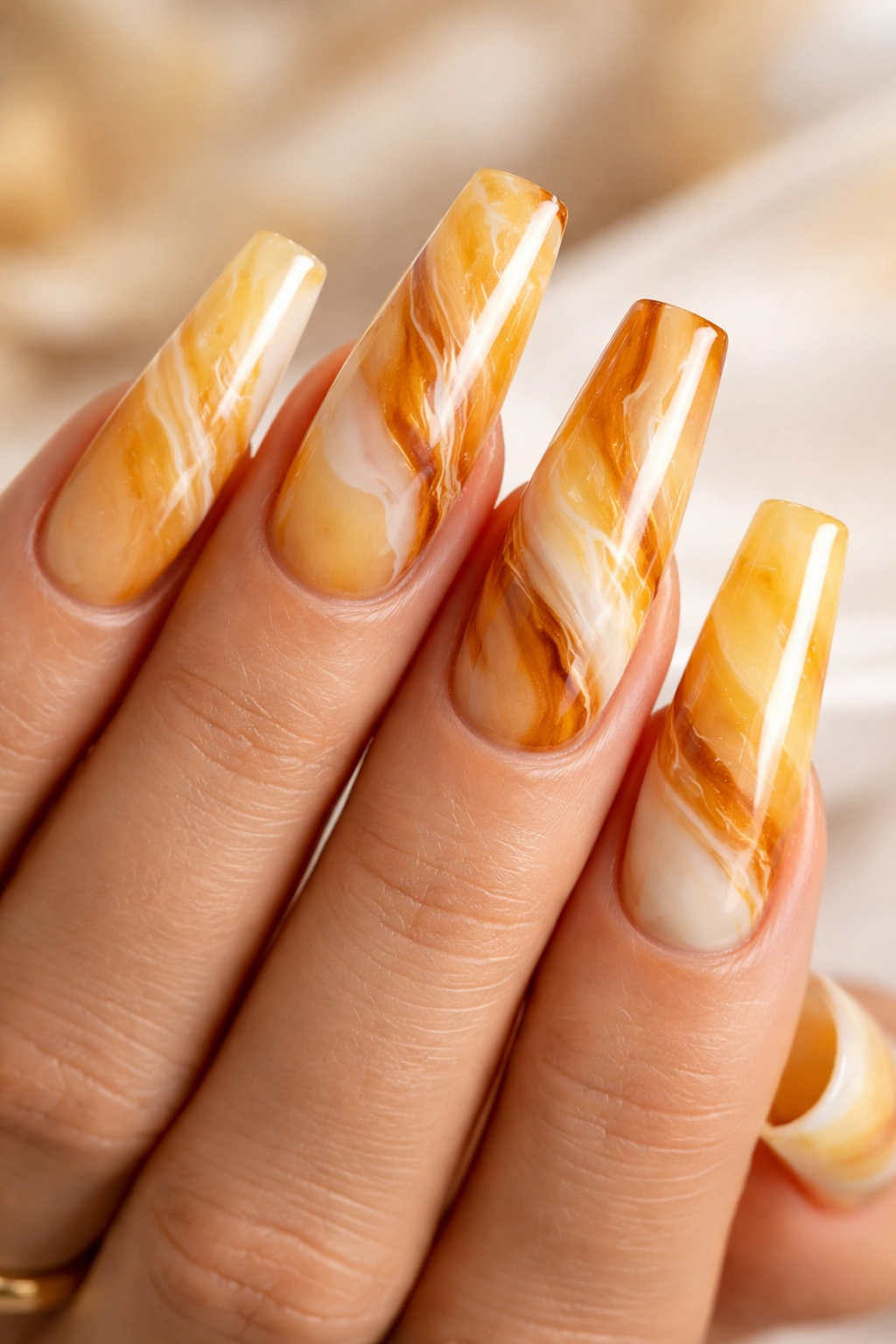 Honey marble coffin nails with amber and caramel swirls