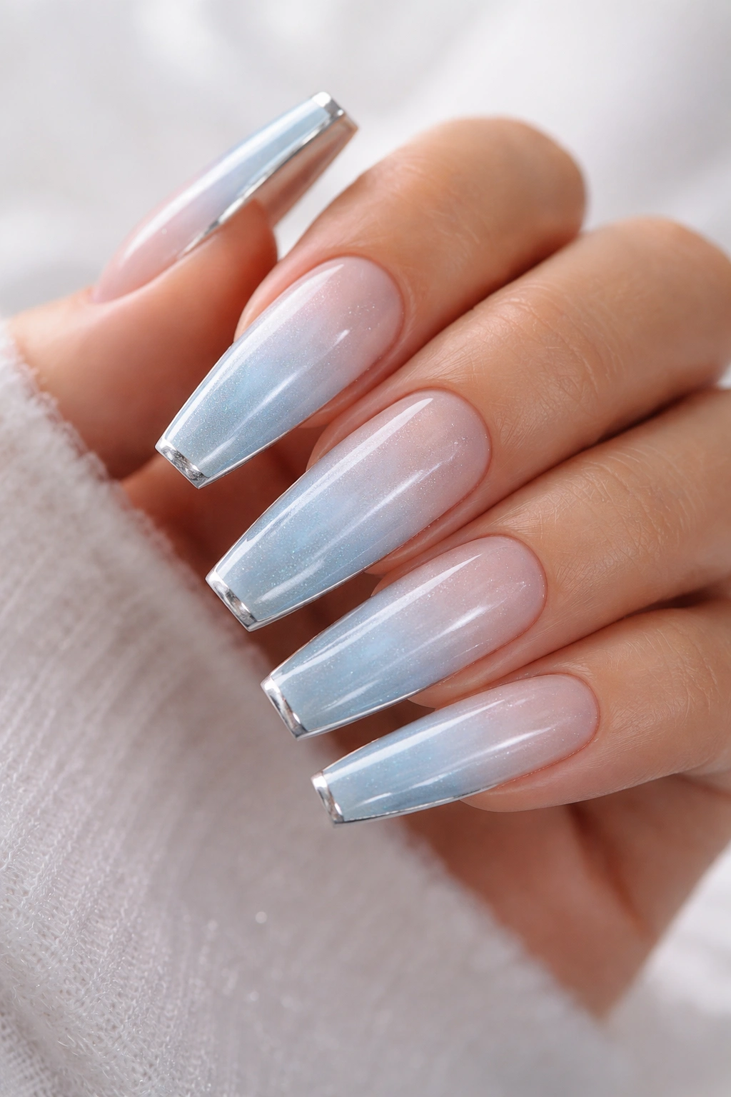 Icy blue ombre coffin nails with thin silver edge