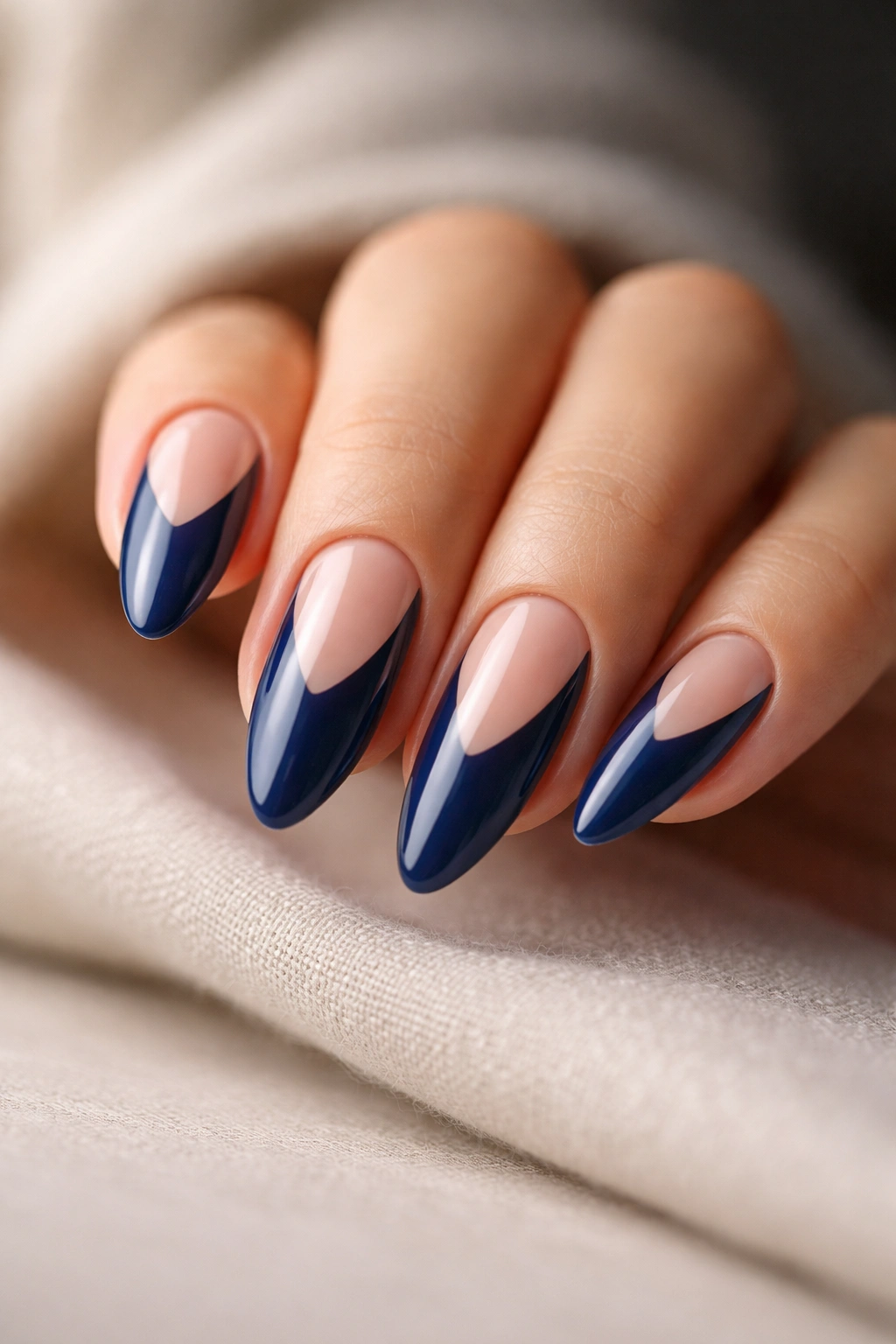 Indigo almond nails with negative-space cutouts close-up