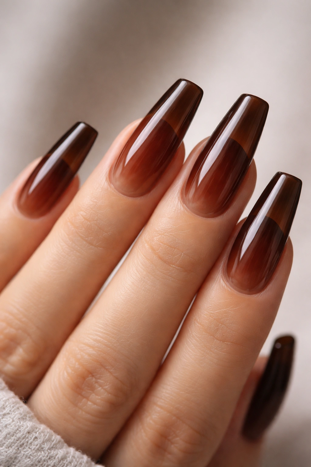 Translucent jelly brown coffin nails showing nail bed beneath
