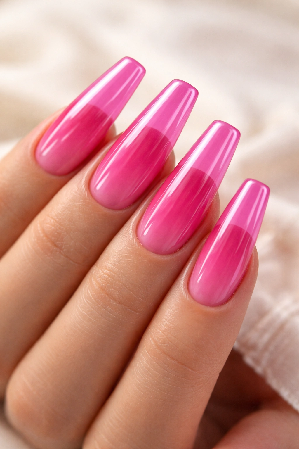 Coffin nails with translucent jelly pink finish showing through light
